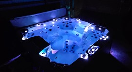 Hot tub lit up at night